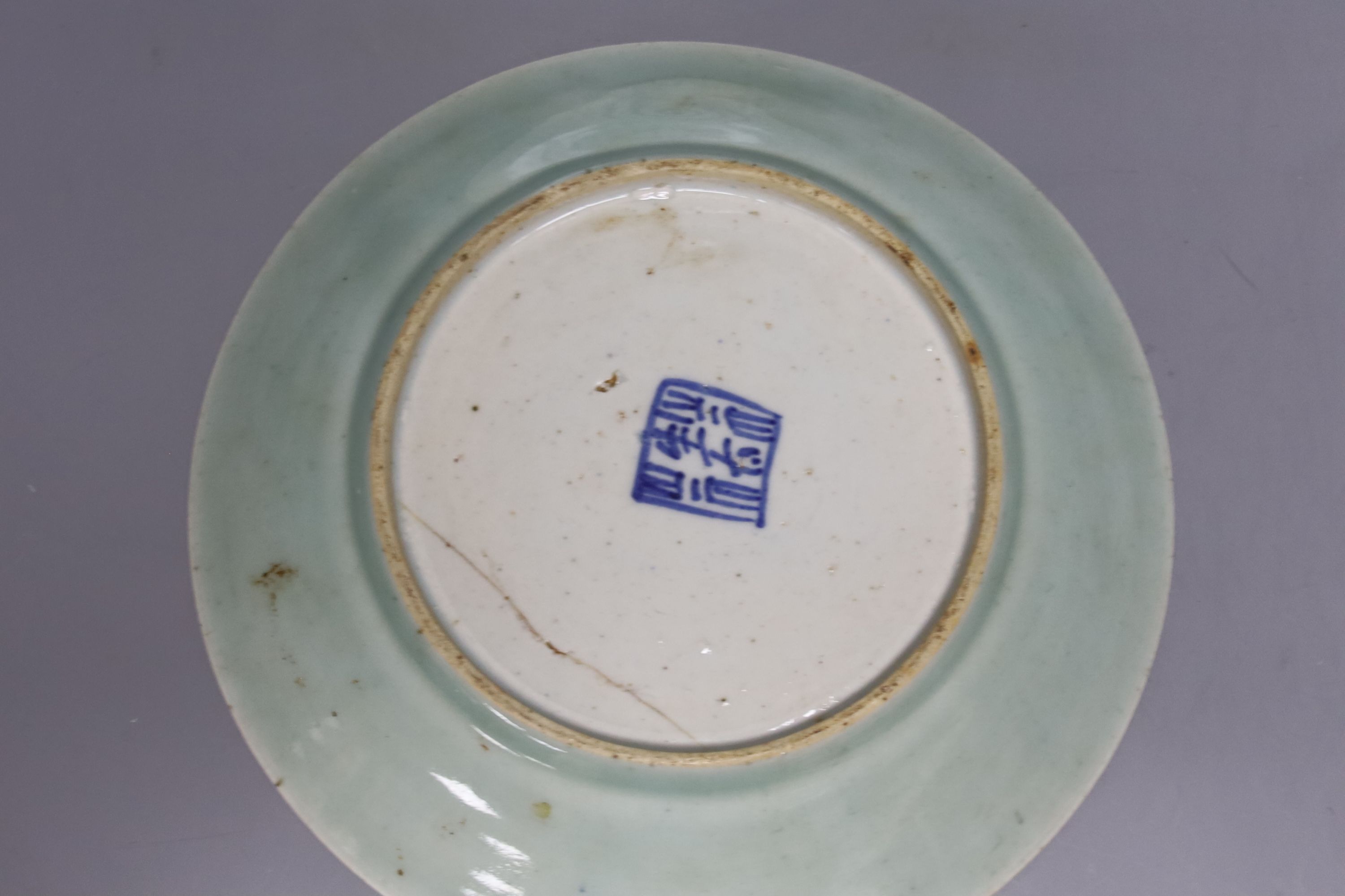 A Japanese crackle glazed dish, another similar and a Chinese celadon glazed dish, largest diameter 29.5cm